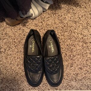 CHANEL Quilted Black Leather Flats